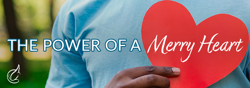 Man wearing blue holding a red heart